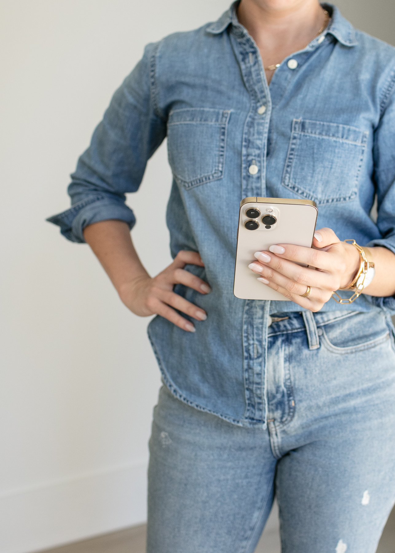 woman-in-blue-jeans-holding-phone